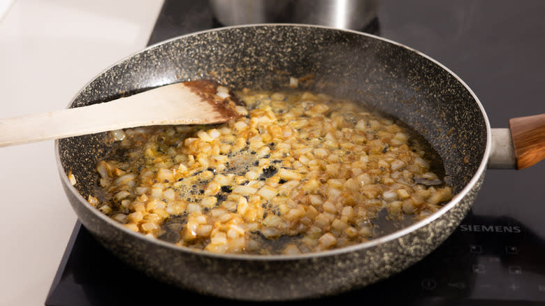 onion and garlic cooking in pan