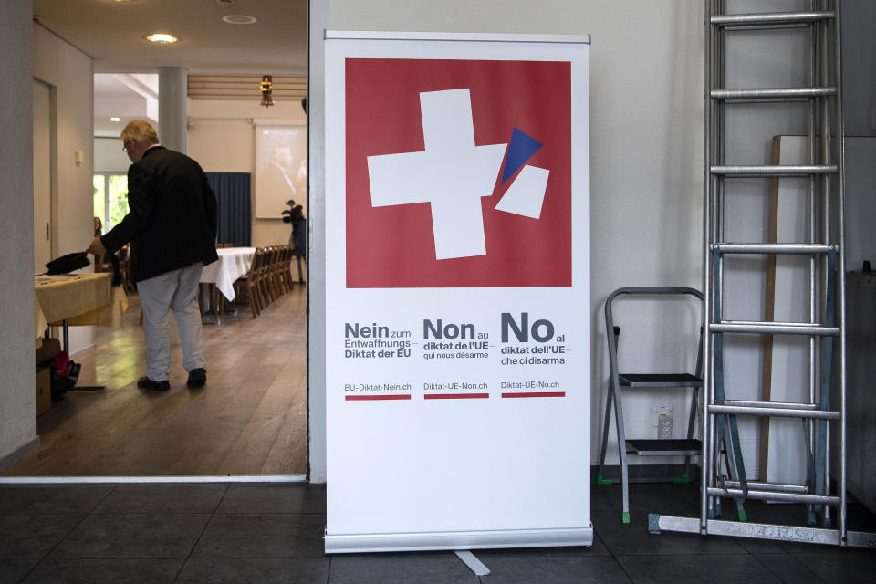 Meeting rooms and a poster of the committee against the EU gun laws and policies, prior to the committee's meeting in Burgdorf, Switzerland, Sunday, May 19, 2019. Swiss voters clearly accepted EU's stricter gun control at the national ballot. (Peter Schneider/Keystone via AP)