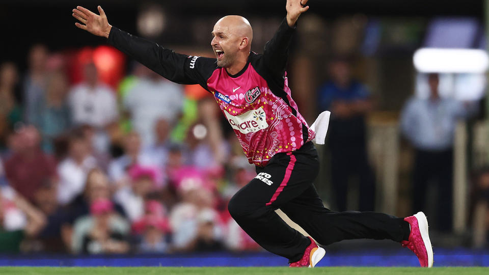Nathan Lyon appeals for a wicket playing for the Sydney Sixers in the BBL.