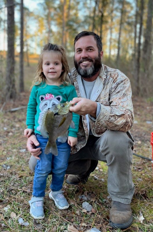 Mary Elizabeth, 2, aka M.E. along with her dad, Colby Hough, proudly displaying her "first" bream caught all by herself on a breambuster from her Uncle Josh's Georgia 
 farm pond.