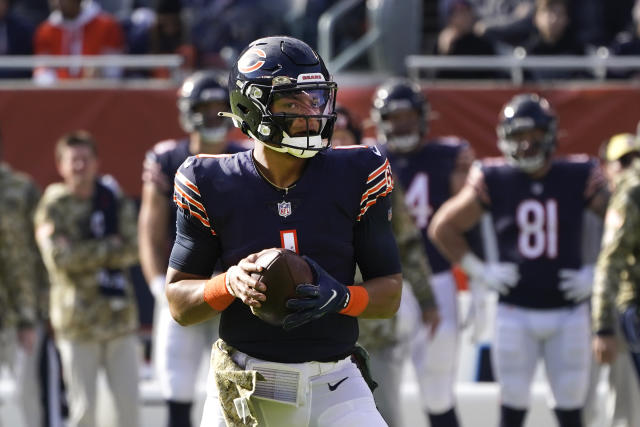 Chicago Bears outside linebacker Robert Quinn strips the ball from  Baltimore Ravens quarterback …