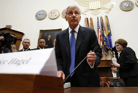 U.S. Defense Secretary Chuck Hagel takes his seat to testify about the Bergdahl prisoner exchange, at a House Armed Services Committee hearing on Capitol Hill in Washington June 11, 2014. REUTERS/Jonathan Ernst