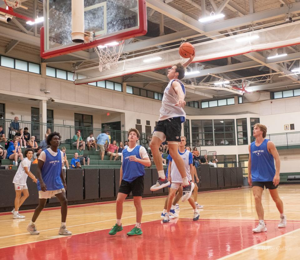 Marlborough resident Austin Hunt of Milton Academy rises for a dunk during the A Shot for Life All-Star Game on Tuesday, August 2, at the Rivers School in Weston.