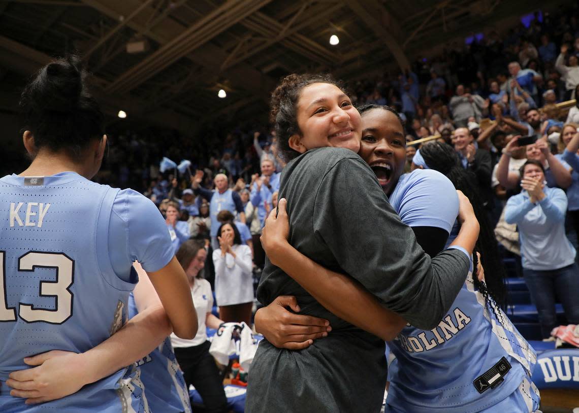 North Carolina’s Alexandra Zelaya and Anya Poole embrace following the Tar Heels’ 45-41 win over Duke on Sunday, Feb. 26, 2023, at Cameron Indoor Stadium in Durham, N.C.