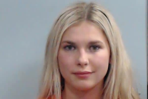 This photo provided by Fayette County Detention Center shows Sophia Rosing. University of Kentucky officials said they are still reviewing an incident in which Rosing is accused of physically assaulting a Black student worker while repeatedly using racial slurs. Rosing was charged Sunday, Nov. 6, 2022 with first and second offenses of public intoxication, third-degree assault of a police officer, fourth-degree assault and second-degree disorderly conduct, according to the Fayette County jail website.