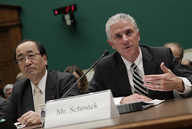 Rick Schostek, executive vice president of Honda North America (R), and Hiroshi Shimizu, Takata's senior vice president of global quality assurance, testify in Washington, DC on December 3, 2014