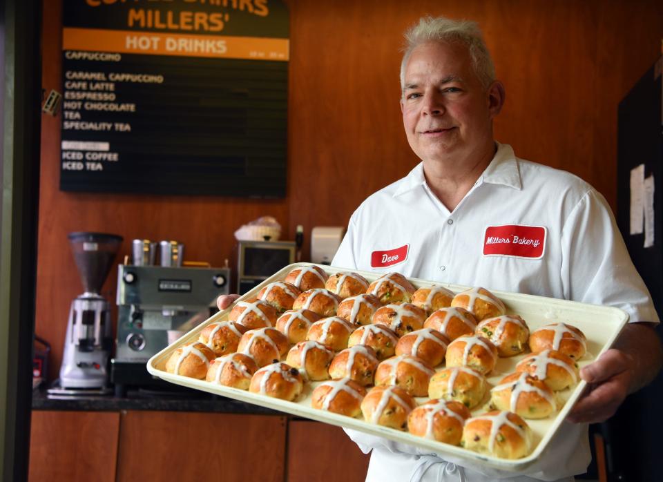 Dave Miller of Millers Bakery in Cliffside Park holds a tray of hot cross buns. The bakery makes the buns from Ash Wednesday through Easter. 