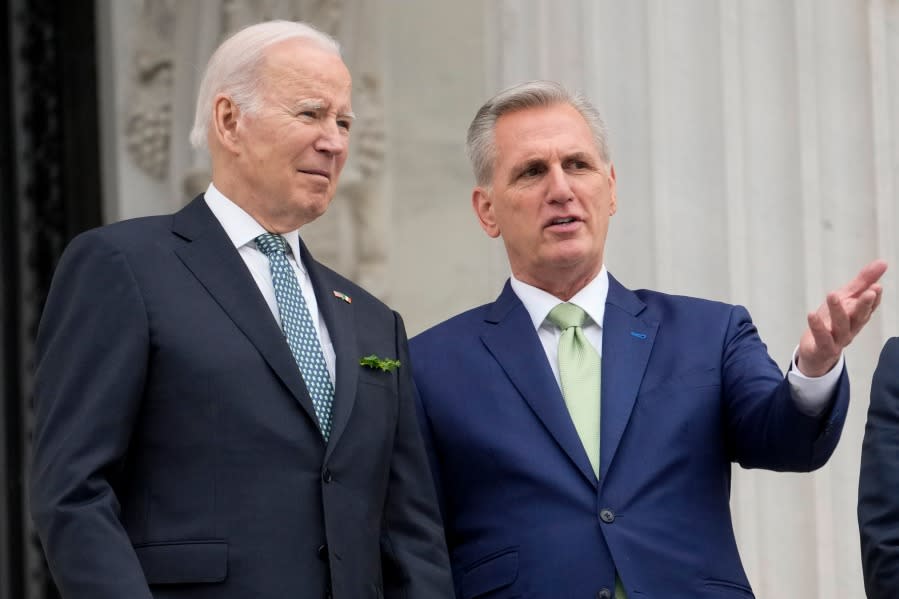 FILE - President Joe Biden talks with House Speaker Kevin McCarthy of Calif., on the House steps as they leave after attending an annual St. Patrick's Day luncheon gathering at the Capitol in Washington, Friday, March 17, 2023. Facing the risk of a government default as soon as June 1, President Joe Biden has invited the top four congressional leaders to a White House meeting for talks on Tuesday, May 9. (AP Photo/Alex Brandon, File)