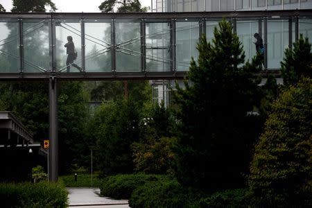 Microsoft employees walk at its Finnish headquarters in Espoo, Finland July 8, 2015. REUTERS/Mikko Stig/Lehtikuva