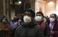 Catholic faithful wearing masks to curb the spread of the new coronavirus attend a Mass at the San Francisco Basilica in La Paz Bolivia, Sunday, Sept. 27, 2020. Churches have reopened for Mass after being closed for months because of the pandemic lockdown. (AP Photo/Juan Karita)