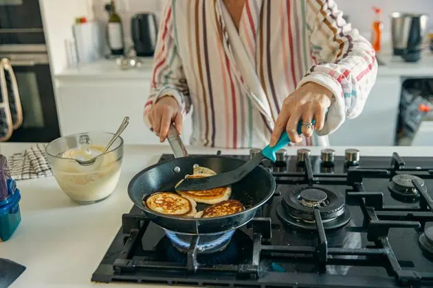 If you're using a gas stove at home, it's important to open a window while you cook.