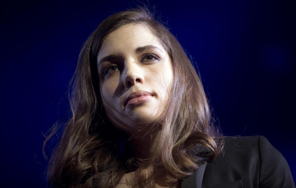 Nadezhda Tolokonnikova, a member of Pussy Riot, stands on stage during Amnesty International's "Bringing Human Rights Home" concert in New York