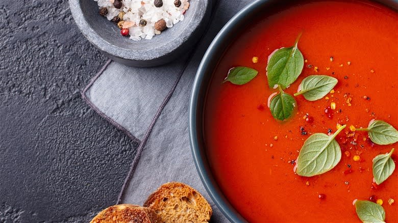 Tomato soup with basil leaves