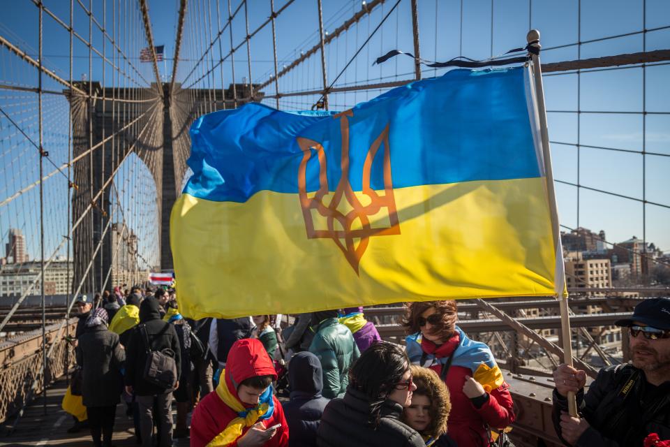 Hundreds march across the Brooklyn Bridge to demonstrate solidarity with protestors killed during the Ukrainian revolution of 2014.