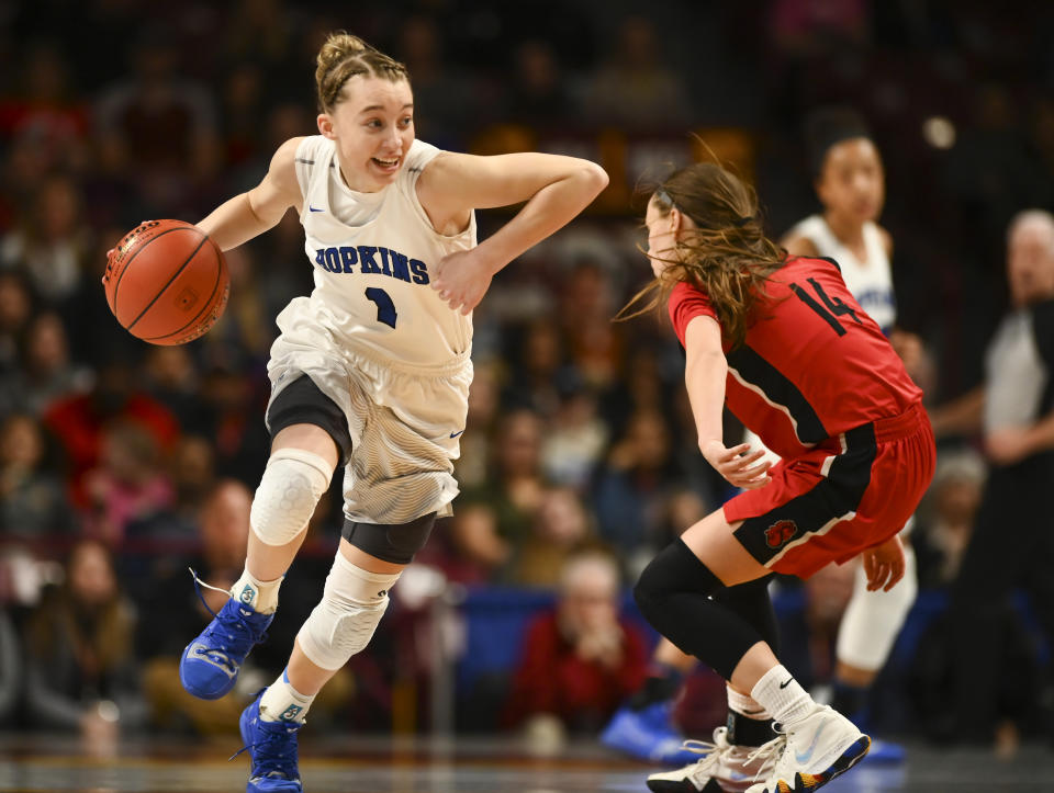 Paige Bueckers on the court in her high school uniform.