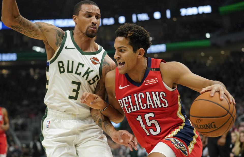 New Orleans Pelicans' Frank Jackson drives past Milwaukee Bucks' George Hill during the first half of an NBA basketball game Wednesday, Dec. 19, 2018, in Milwaukee. (AP Photo/Morry Gash)