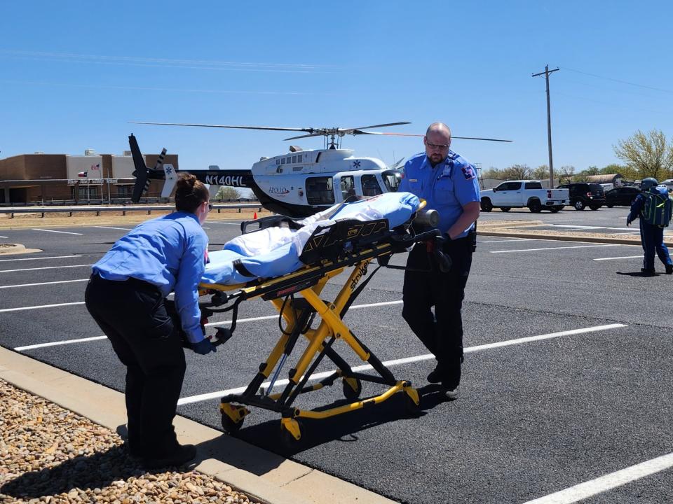 The Texas Department of Transportation in partnership with area first responders demonstrates "Shattered Dreams," a fatal crash simulation due to driving under the influence, for River Road High School students on Wednesday in the school's parking lot.