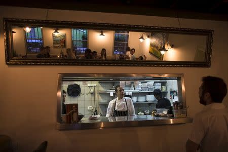 Oded Viner-Shwarzbard stands in the kitchen of the restaurant he runs in Kibbutz Degania Alef on the shores of the Sea of Galilee, northern Israel May 23, 2015. REUTERS/Ronen Zvulun