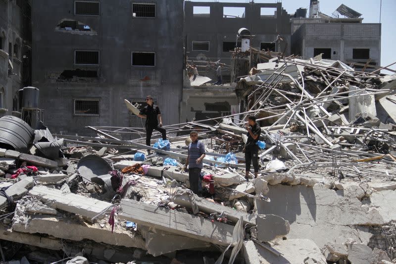 Palestinians inspect the damage after Israeli forces withdrew from Jabalia refugee camp