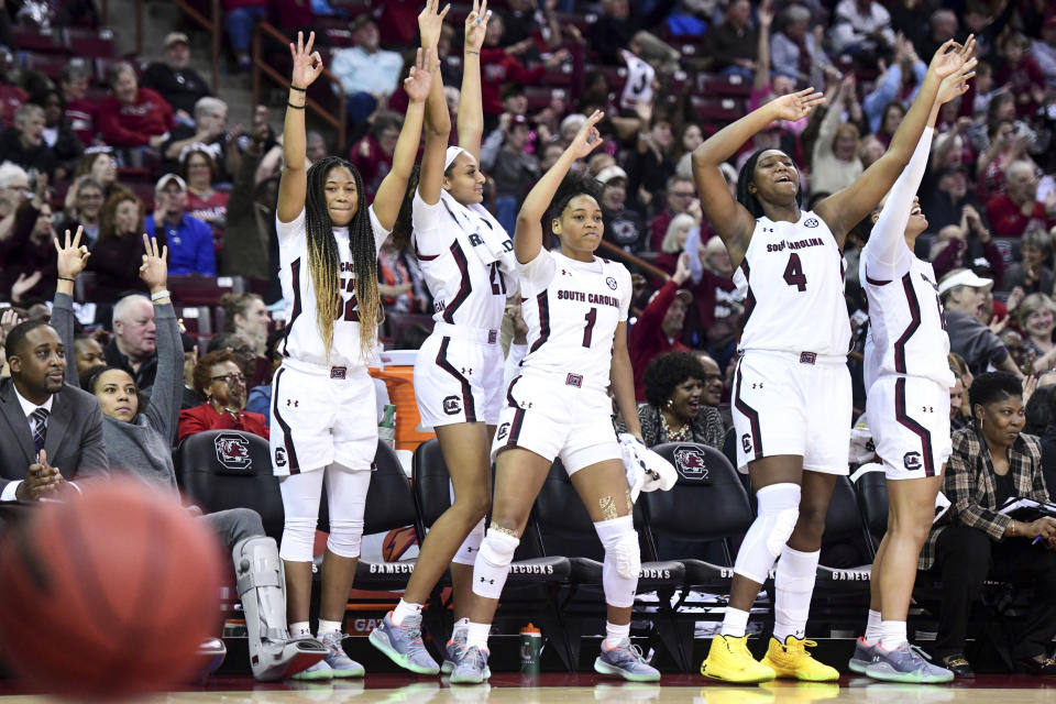 South Carolina guard Zia Cooke (1), Tyasha Harris, left, Mikiah Herbert Harrigan (21), and Aliyah Boston (4) celebrate a 3-point basket during the second half of the team's NCAA college basketball game against Duke on Thursday, Dec. 19, 2019, in Columbia, S.C. South Carolina defeated Duke 89-46. (AP Photo/Sean Rayford)