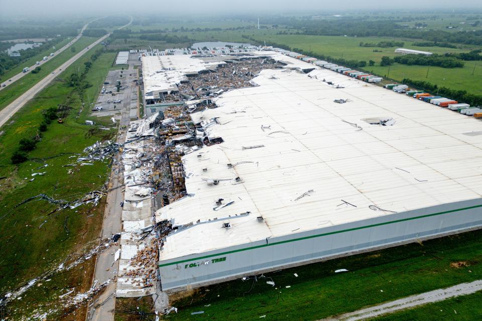 A tornado caused extensive damage to the Dollar Tree distribution center in Marietta, where nearly 500 people worked.