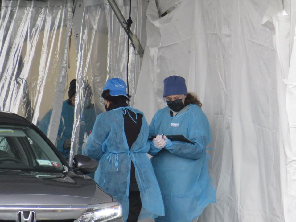 Cayuga Medical Center personnel collected samples for coronavirus testing at a sampling center location set up in the parking lot of The Shops at Ithaca Mall.