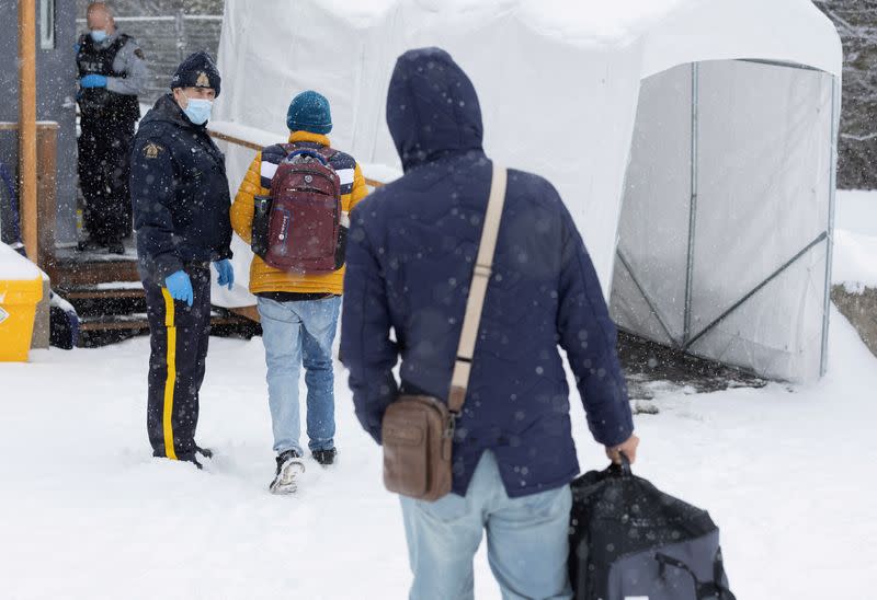 FILE PHOTO: Asylum seekers cross into Canada from Roxham Road in Champlain New York