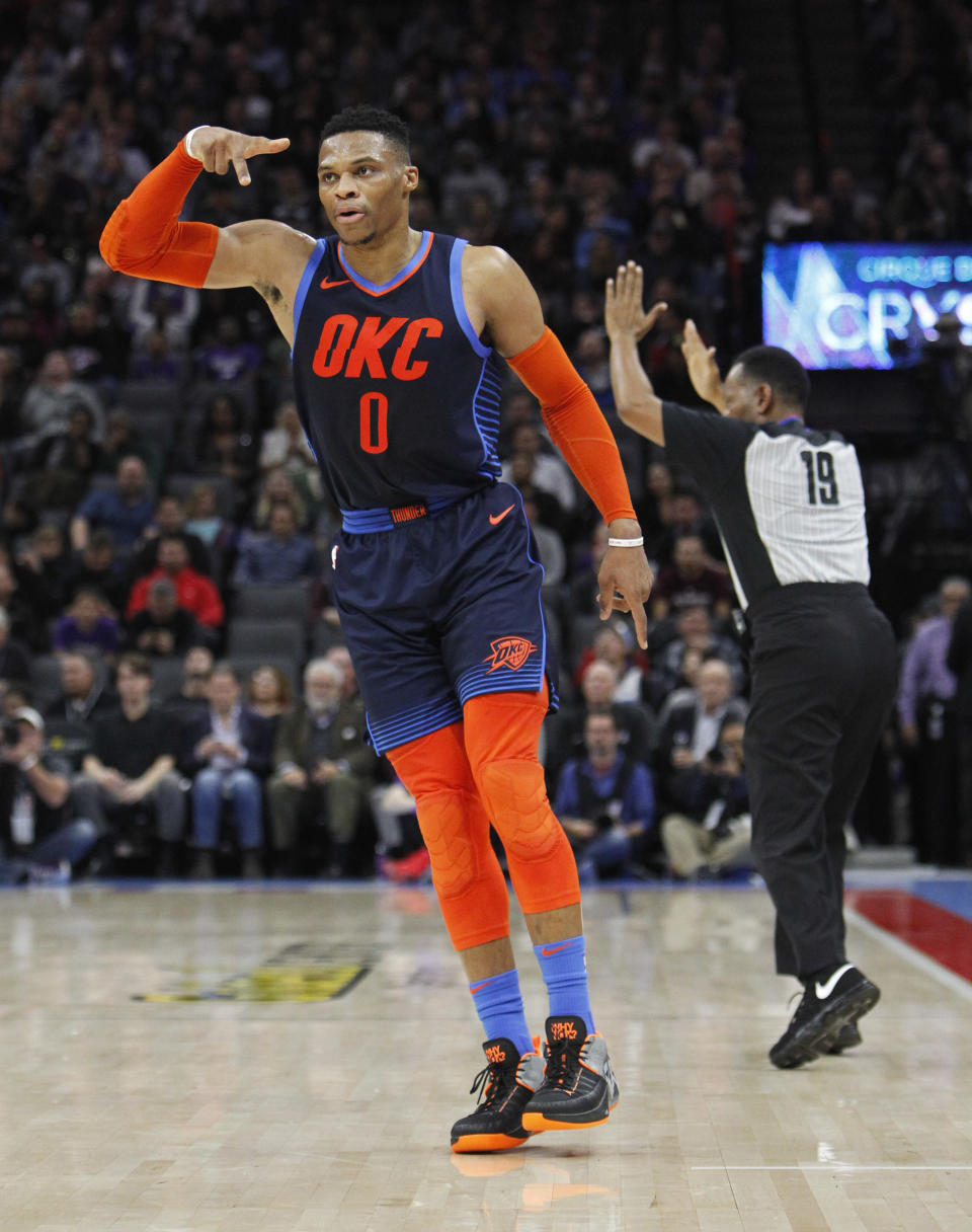 Oklahoma City Thunder guard Russell Westbrook (0) celebrates after hitting a 3-point basket against the Sacramento Kings during the first half of an NBA basketball game in Sacramento, Calif., Wednesday, Dec. 19, 2018. (AP Photo/Steve Yeater)