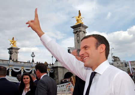 French President Emmanuel Macron waves to the crowd in Paris, France, June 24, 2017. REUTERS/Jean-Paul Pelissier