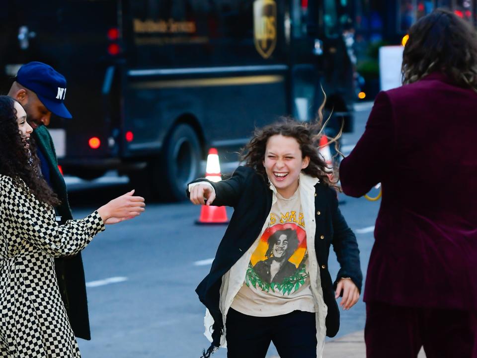 jason moma's children laughing and pointing at each other while he looks on at the batman premiere