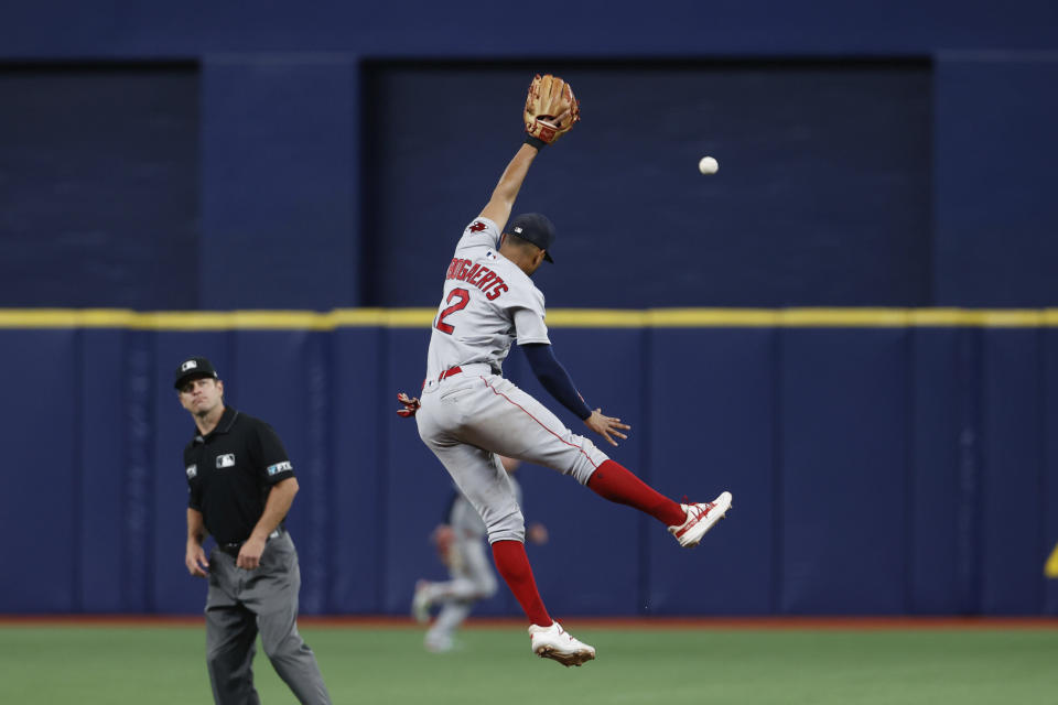 Boston Red Sox shortstop Xander Bogaerts (2) leaps for the ball against the Tampa Bay Rays during the fifth inning of a baseball game Sunday, Aug. 1, 2021, in St. Petersburg, Fla. (AP Photo/Scott Audette)