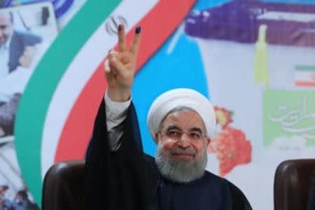 FILE PHOTO: Iran's President Hassan Rouhani gestures as he registers to run for a second four-year term in the May election, in Tehran, Iran, April 14, 2017. President.ir/Handout/File Photo via REUTERS.