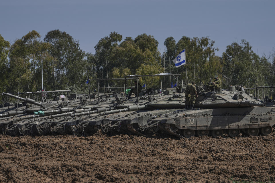 Israeli tanks parked in a staging area near the Gaza Strip border in southern Israel, Wednesday, March 13, 2024. (AP Photo/Tsafrir Abayov)