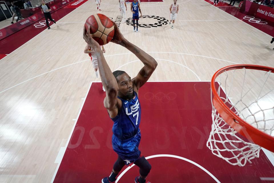 USA player Kevin Durant (7) dunks against Spain during the Tokyo 2020 Olympic Summer Games at Saitama Super Arena.