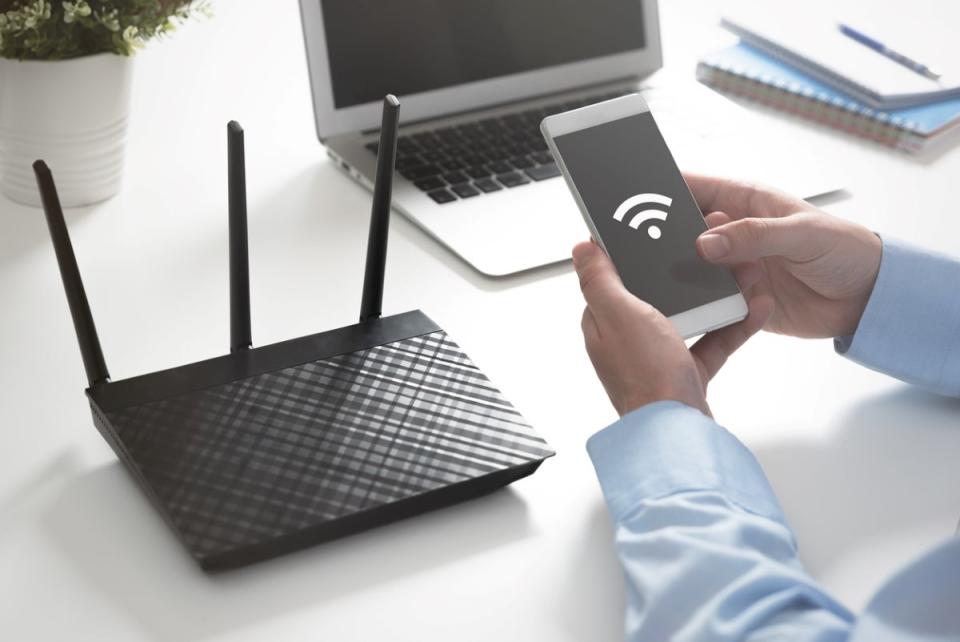 Person looking to connect phone to wifi router