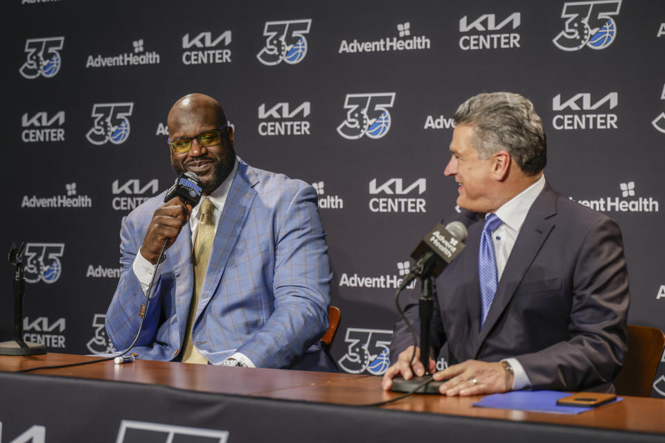 Shaquille O'Neal, left, and Alex Martins, right, CEO of the Orlando Magic, speak during a pre-game press conference about the Orlando Magic retiring his jersey before the Oklahoma City Thunder NBA basketball game, Tuesday, Feb. 13, 2024, in Orlando, Fla. (AP Photo/Kevin Kolczynski)