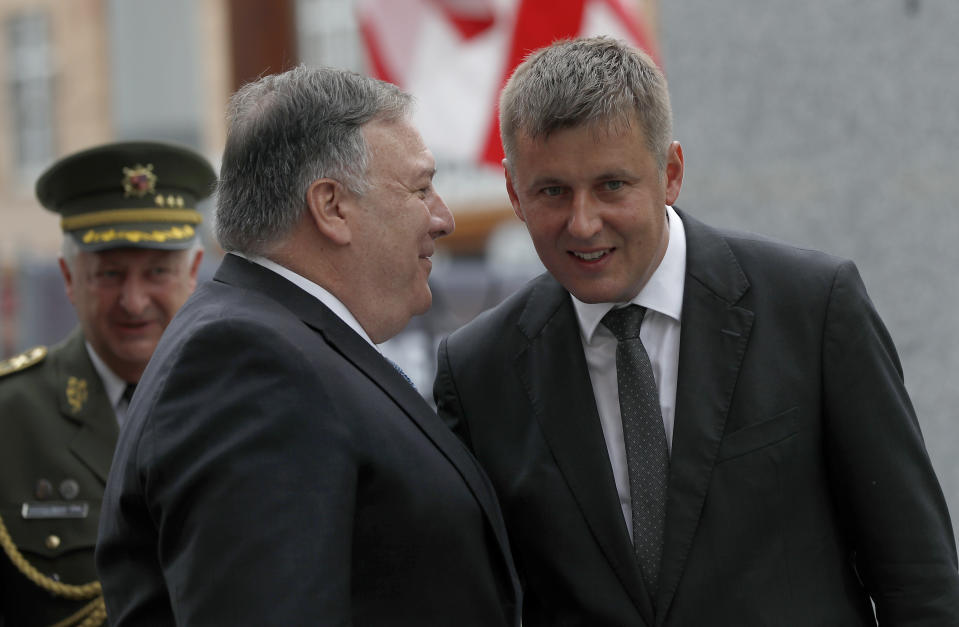 U.S. Secretary of State Mike Pompeo, front left, talks to Czech Republic's Foreign Minister Tomas Petricek, right, during a ceremony at the General Patton memorial in Pilsen near Prague, Czech Republic, Tuesday, Aug. 11, 2020. U.S. Secretary of State Mike Pompeo is in Czech Republic at the start of a four-nation tour of Europe. Slovenia, Austria and Poland are the other stations of the trip. (AP Photo/Petr David Josek, Pool)