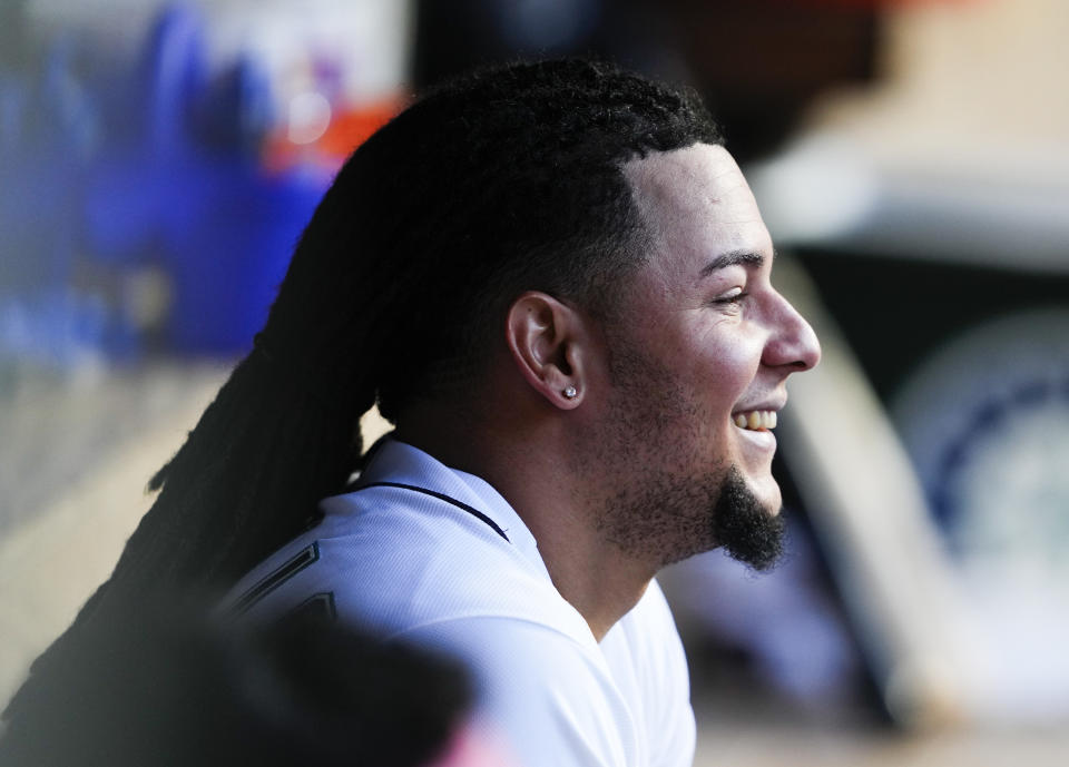 Seattle Mariners starting pitcher Luis Castillo smiles in the dugout during the fifth inning of a baseball game against the Washington Nationals, Monday, June 26, 2023, in Seattle. (AP Photo/Lindsey Wasson)