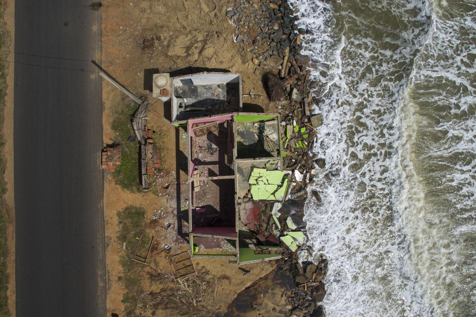 Waves lap up against the remains of the Ranjit Sunimal Fernando family home in Iranawila, Colombo, Sri Lanka, Monday, June 19, 2023. Much like the hundreds of other fishing hamlets that dot the coastline, the village of Iranawila suffers from coastal erosion. (AP Photo/Eranga Jayawardena)