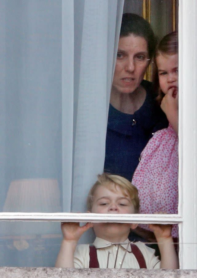 LONDON, UNITED KINGDOM – JUNE 17: (EMBARGOED FOR PUBLICATION IN UK NEWSPAPERS UNTIL 48 HOURS AFTER CREATE DATE AND TIME) Prince George of Cambridge and Princess Charlotte of Cambridge, accompanied by their nanny Maria Teresa Borrallo, watch from a window of Buckingham Palace during the annual Trooping the Colour Parade on June 17, 2017 in London, England. Trooping the Colour is a military parade to mark Queen Elizabeth II’s official birthday and dates back to the time of Charles II in the 17th Century when the Colours of a Regiment were used as a rallying point in battle. (Photo by Max Mumby/Indigo/Getty Images)