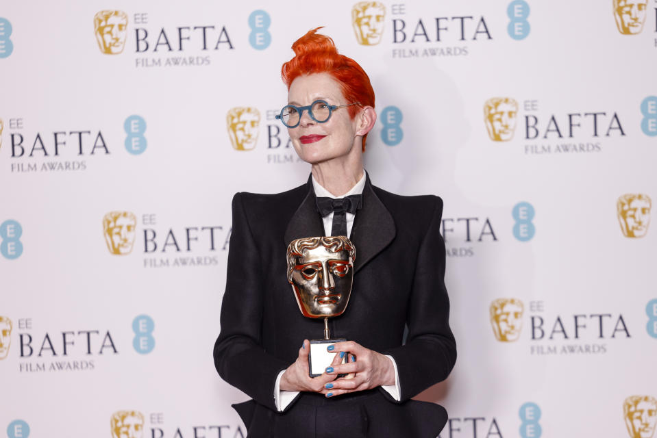 Costume designer Sandy Powell poses for photographers after winning the Fellowship Award at the 76th British Academy Film Awards, BAFTA's, in London, Sunday, Feb. 19, 2023 (Photo by Vianney Le Caer/Invision/AP)