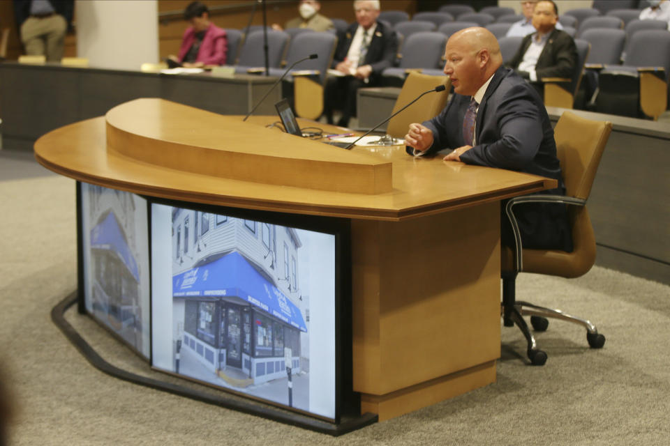 Jim Stage, owner of Lloyds Pharmacy in Minneapolis, testifies during a hearing Wednesday, July 1, 2020 in St. Paul, Minn. about his business which was destroyed during civil unrest after the death of George Floyd. Minnesota Republican lawmakers opened a series of hearings on the unrest that rocked the state after the death of Floyd who died in police custody, focusing Wednesday on the lawlessness and destruction of small businesses that ensued. (AP Photo/Jim Mone)