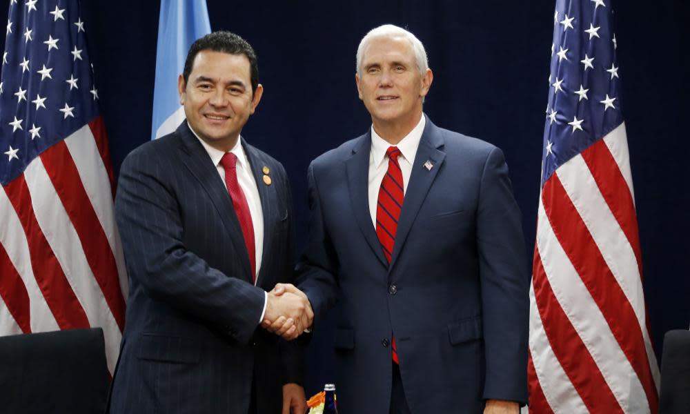 Jimmy Morales and Mike Pence at a summit in Miami last week. Several members of Barnes & Thornburg have worked for the vice-president in the past.