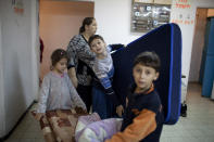 Israeli children sit in a bomb shelter on November 14, 2012 in Netivot, Israel. (Photo by Uriel Sinai/Getty Images)