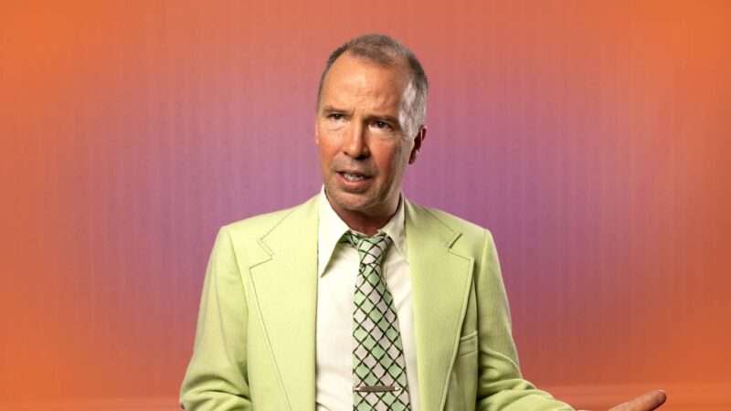 Doug Stanhope on an orange and pink background