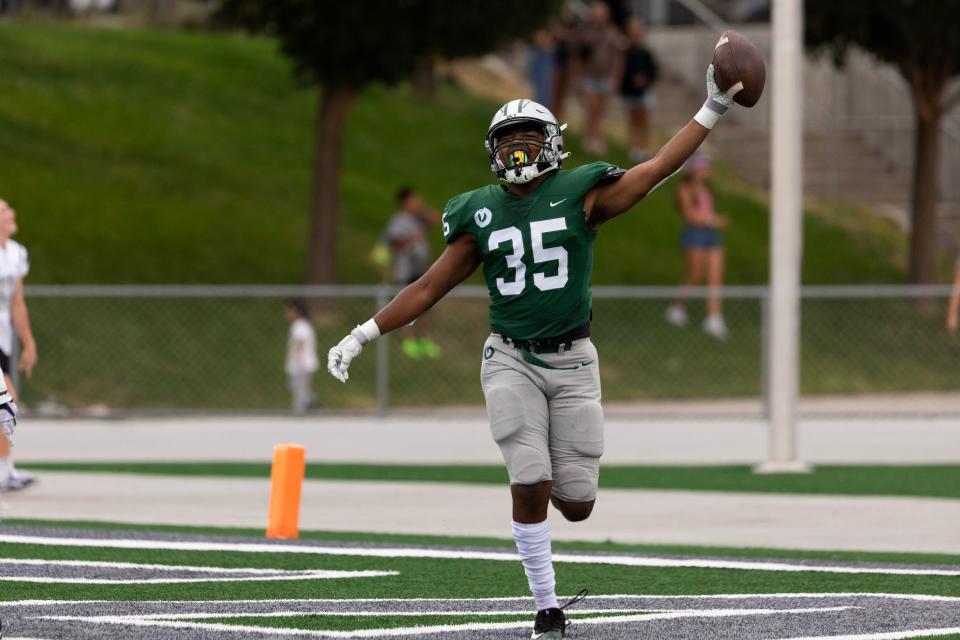 Olympus’s Gabe Johnson celebrates his touchdown, a fumble recovery in the end zone, in the high school football game against Provo at Olympus High School in Holladay on Friday, Aug. 18, 2023. | Megan Nielsen, Deseret News