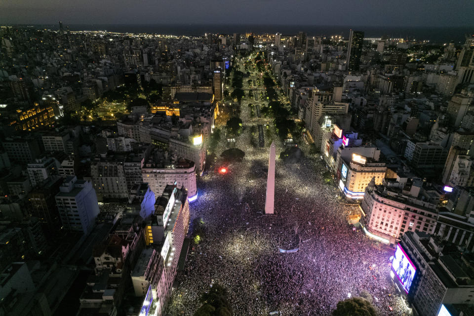 Argentine soccer fans crowd the capital's Obelisk to celebrate their team's World Cup victory over France in Buenos Aires, Argentina, Sunday, Dec. 18, 2022. (AP Photo/Rodrigo Abd)
