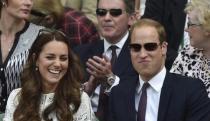 Britain's Prince William and his wife Catherine, Duchess of Cambridge sit on Centre Court at the Wimbledon Tennis Championships, in London July 2, 2014. REUTERS/Toby Melville