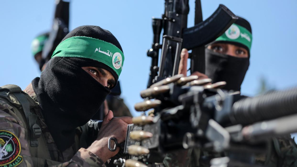  Hamas fighters take part in a military parade in June 2023. 