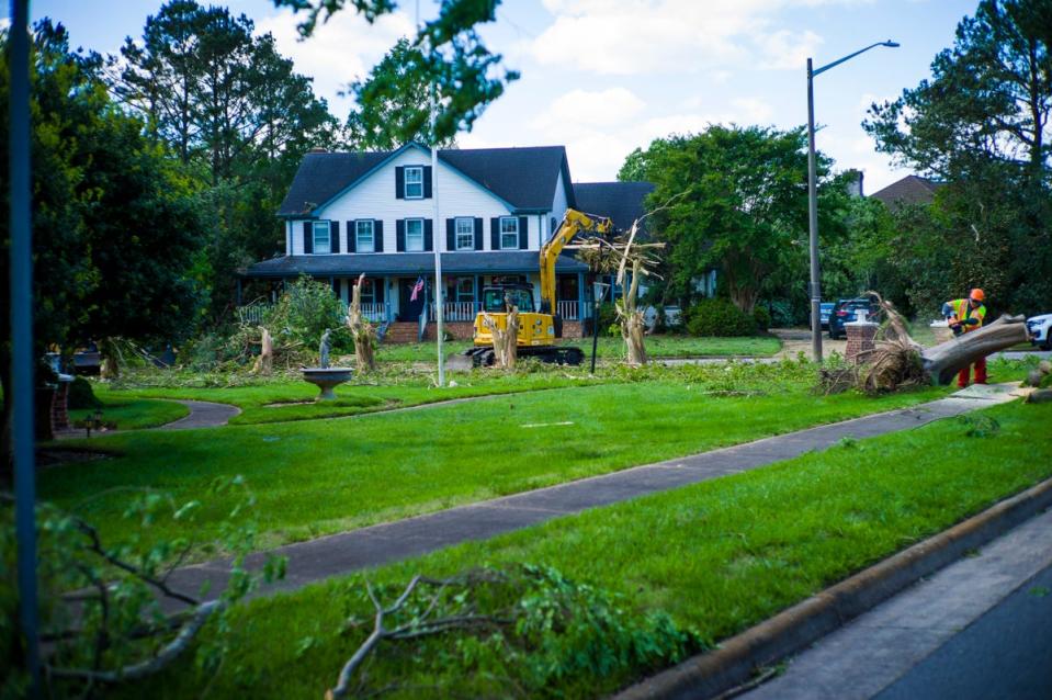 Damage from Sunday's EF-3 rated tornado is cleaned up in the Great Neck area of Virginia Beach, Va., on Monday May 1, 2023 (AP)